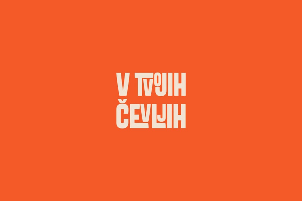 Logotip V TVOJIH ČEVLJIH na oranžni podlagi